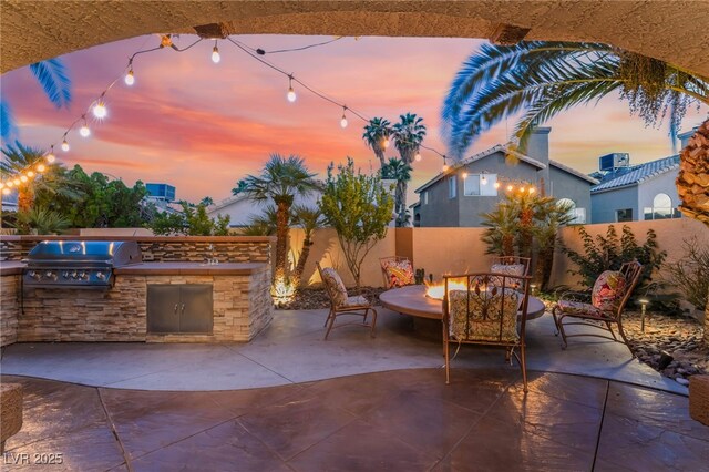 5779 Baffy Cir, Las Vegas, NV 89142 - patio terrace at dusk featuring a patio and a fenced backyard