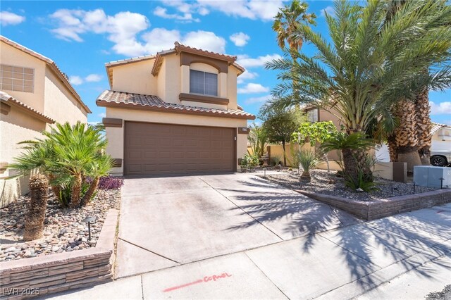 5779 Baffy Cir, Las Vegas, NV 89142 - mediterranean / spanish-style house featuring stucco siding, driveway, an attached garage, and a tile roof