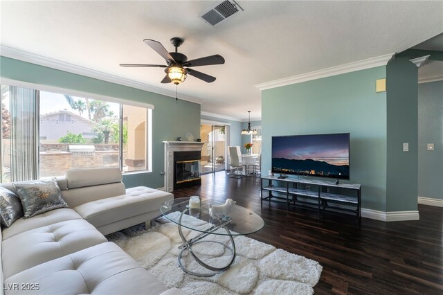 5779 Baffy Cir, Las Vegas, NV 89142 - living room with ornamental molding, a ceiling fan, baseboards, wood finished floors, and a chandelier
