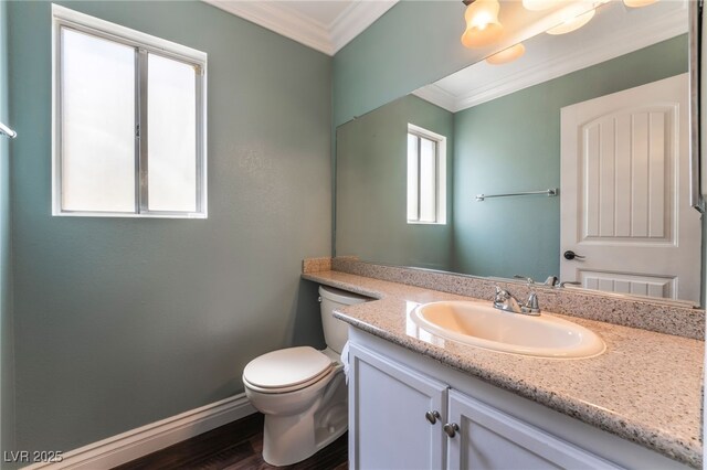 5779 Baffy Cir, Las Vegas, NV 89142 - bathroom with ornamental molding, vanity, toilet, baseboards, and wood finished floors