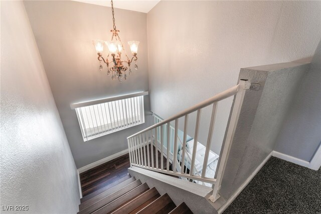 5779 Baffy Cir, Las Vegas, NV 89142 - staircase with a chandelier, baseboards, and wood finished floors