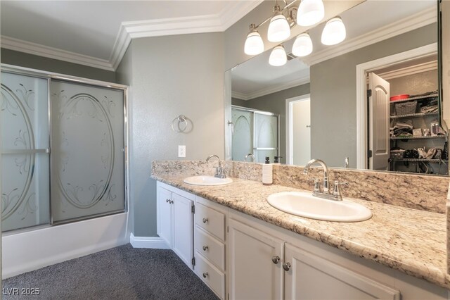 5779 Baffy Cir, Las Vegas, NV 89142 - bathroom featuring double vanity, crown molding, bath / shower combo with glass door, and a closet