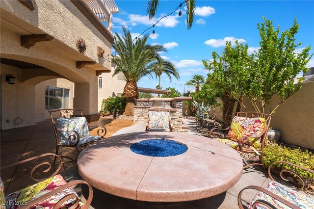 5779 Baffy Cir, Las Vegas, NV 89142 - fenced backyard featuring a patio and an outdoor kitchen