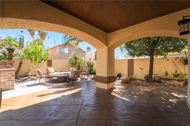 5779 Baffy Cir, Las Vegas, NV 89142 - fenced backyard with a patio area