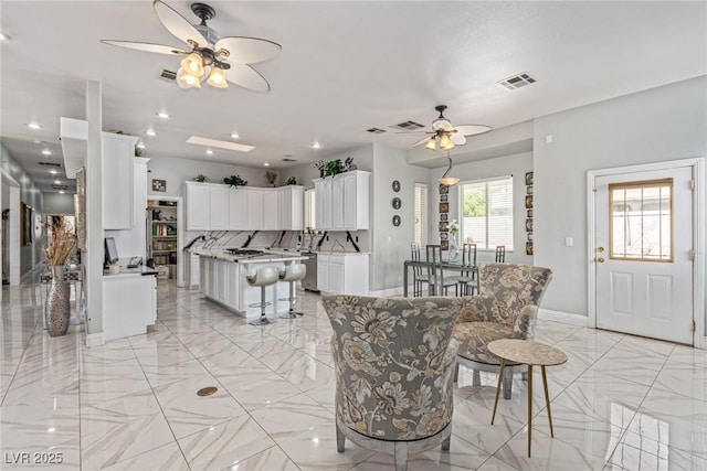 60 N Fogg St, Las Vegas, NV 89110 - dining space featuring a ceiling fan, light marble finish floors, baseboards, and recessed lighting