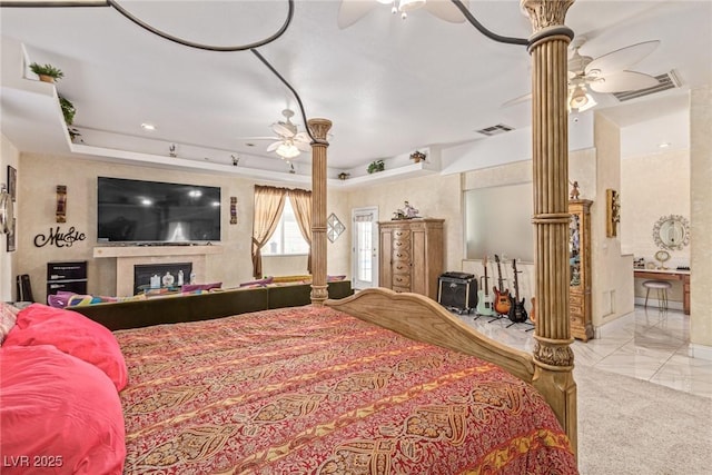 60 N Fogg St, Las Vegas, NV 89110 - bedroom with decorative columns, ceiling fan, and connected bathroom
