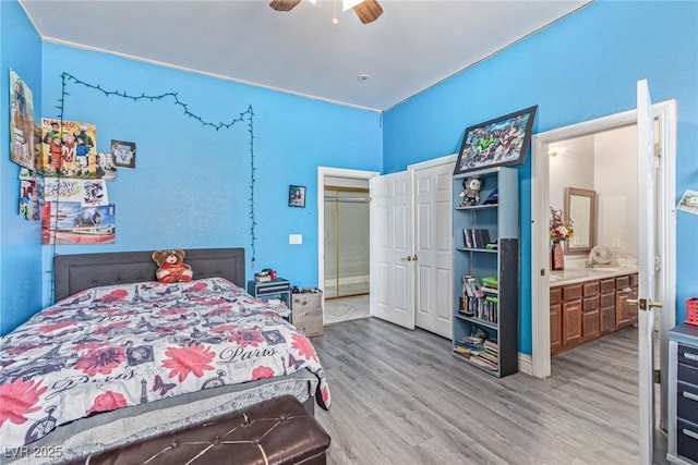 60 N Fogg St, Las Vegas, NV 89110 - bedroom featuring wood finished floors, ensuite bath, and a ceiling fan