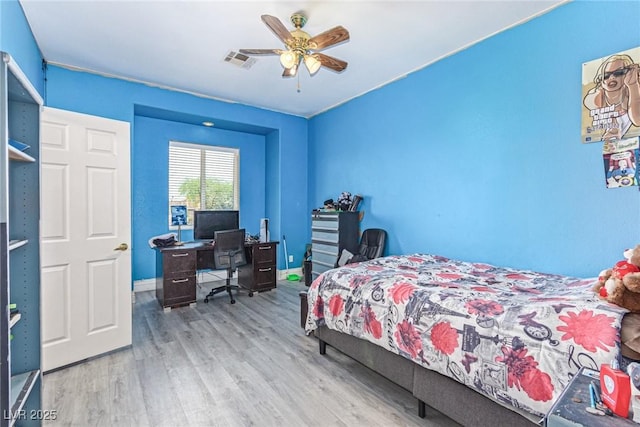 60 N Fogg St, Las Vegas, NV 89110 - bedroom with wood finished floors, a desk, baseboards, and ceiling fan