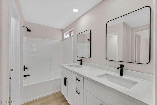 4132 Joyous St, North Las Vegas, NV 89032 - bathroom featuring double vanity, tub / shower combination, and wood finished floors