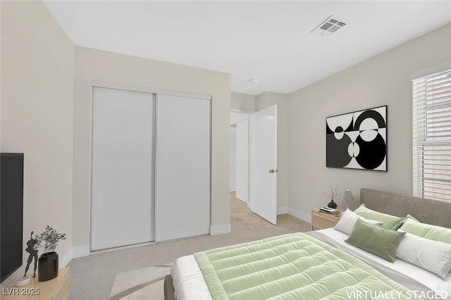4132 Joyous St, North Las Vegas, NV 89032 - bedroom featuring light carpet, baseboards, and a closet