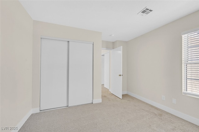 4132 Joyous St, North Las Vegas, NV 89032 - unfurnished bedroom with carpet floors, baseboards, and a closet