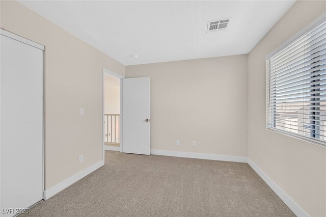 4132 Joyous St, North Las Vegas, NV 89032 - unfurnished bedroom featuring light carpet and baseboards