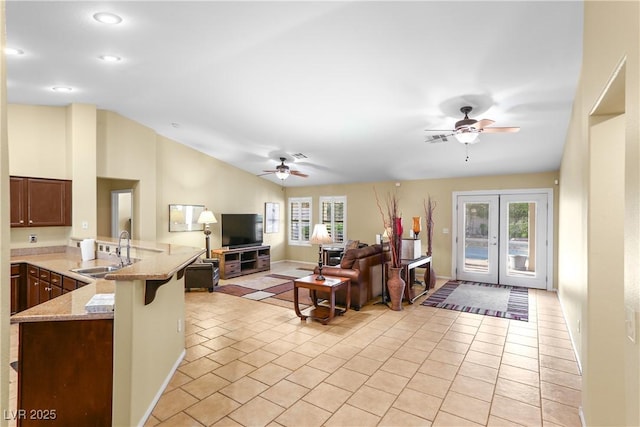 8928 Rusty Rifle Ave, Las Vegas, NV 89143 - living room featuring ceiling fan, french doors, recessed lighting, light tile patterned floors, and lofted ceiling