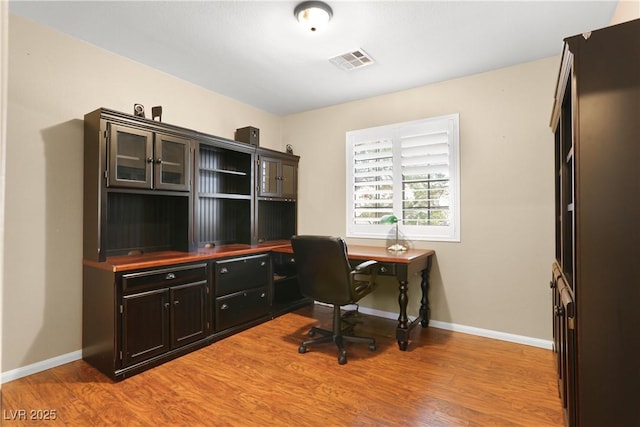 8928 Rusty Rifle Ave, Las Vegas, NV 89143 - office with light wood finished floors and baseboards