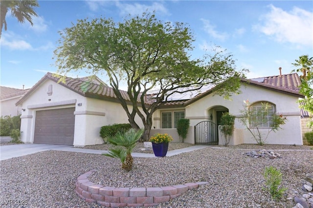 8928 Rusty Rifle Ave, Las Vegas, NV 89143 - mediterranean / spanish-style home featuring stucco siding, a gate, a garage, and driveway