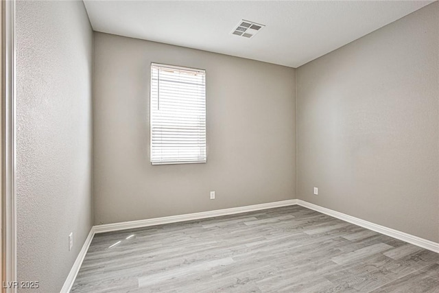 9271 Martel Ave, Las Vegas, NV 89148 - spare room featuring wood finished floors and baseboards