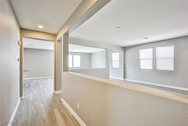 9271 Martel Ave, Las Vegas, NV 89148 - hallway featuring light wood finished floors and baseboards