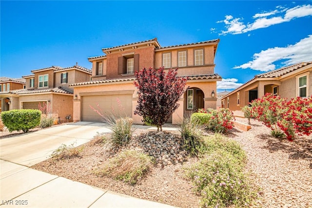 9271 Martel Ave, Las Vegas, NV 89148 - mediterranean / spanish-style house with concrete driveway, stucco siding, an attached garage, and a tiled roof