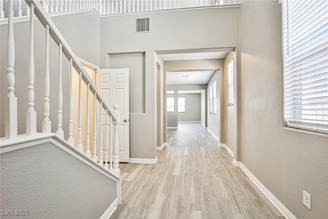 9271 Martel Ave, Las Vegas, NV 89148 - corridor featuring wood finished floors, stairway, baseboards, and a textured wall