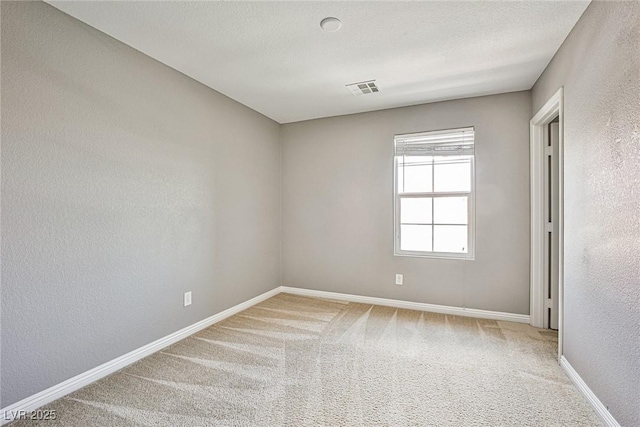 9271 Martel Ave, Las Vegas, NV 89148 - empty room with light carpet, a textured wall, and baseboards