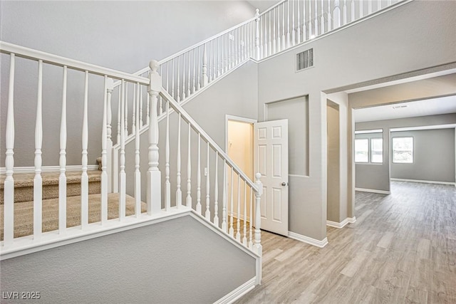 9271 Martel Ave, Las Vegas, NV 89148 - stairway with wood finished floors, baseboards, and a towering ceiling