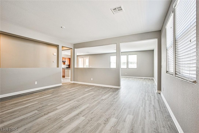 9271 Martel Ave, Las Vegas, NV 89148 - spare room featuring wood finished floors and baseboards
