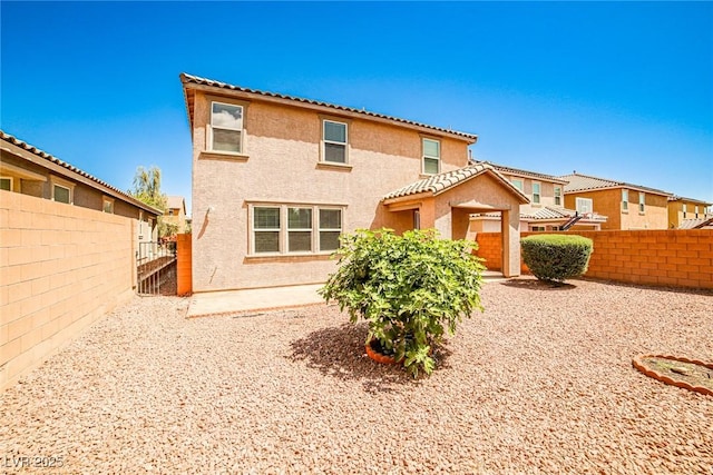 9271 Martel Ave, Las Vegas, NV 89148 - back of house with stucco siding, a fenced backyard, and a tiled roof