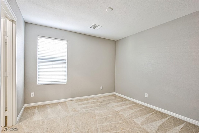 9271 Martel Ave, Las Vegas, NV 89148 - spare room featuring carpet flooring, healthy amount of natural light, baseboards, and a textured ceiling