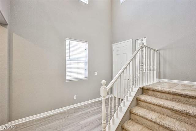 9271 Martel Ave, Las Vegas, NV 89148 - staircase with wood finished floors, baseboards, and a towering ceiling