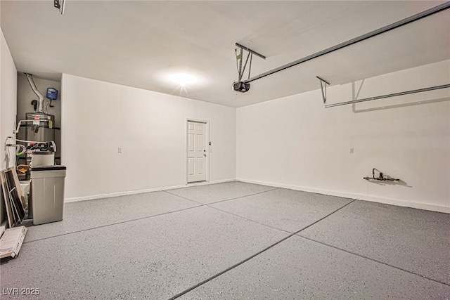 9271 Martel Ave, Las Vegas, NV 89148 - garage featuring baseboards, a garage door opener, and secured water heater