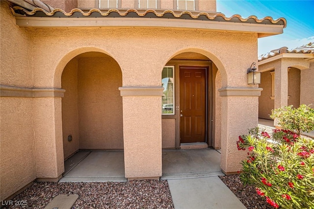 9271 Martel Ave, Las Vegas, NV 89148 - view of exterior entry featuring stucco siding and a tiled roof