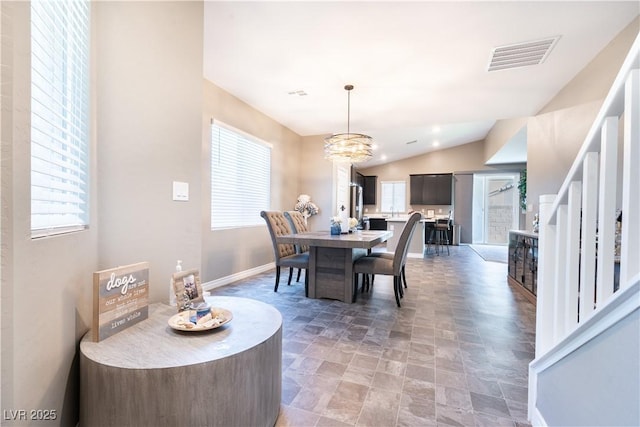 4376 Latitude Valley Ct, North Las Vegas, NV 89084 - dining area with a chandelier, baseboards, lofted ceiling, stone finish floors, and stairs