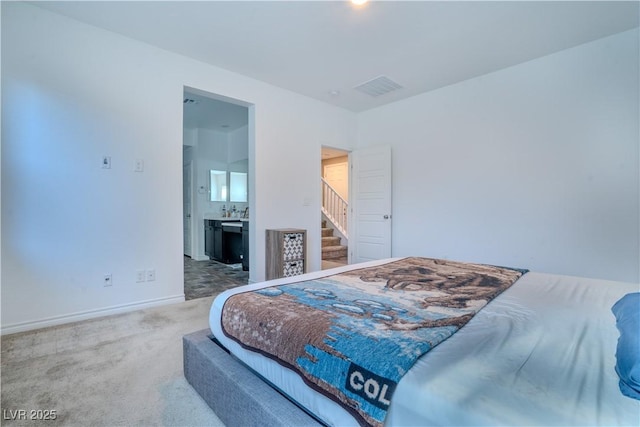 4376 Latitude Valley Ct, North Las Vegas, NV 89084 - bedroom with carpet flooring, baseboards, and connected bathroom