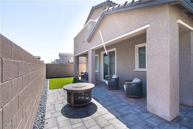 4376 Latitude Valley Ct, North Las Vegas, NV 89084 - fenced backyard with a patio and an outdoor fire pit