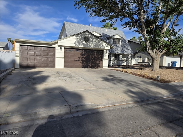 3056 Garnet Ct, Las Vegas, NV 89121 - view of front of home featuring a garage, concrete driveway, and a shingled roof