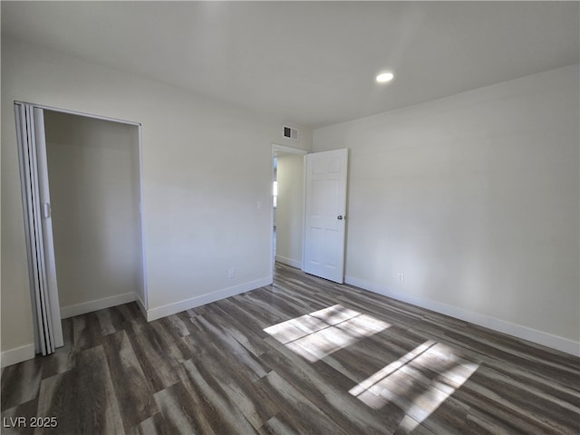 3056 Garnet Ct, Las Vegas, NV 89121 - unfurnished bedroom with dark wood-style flooring, baseboards, recessed lighting, and a closet