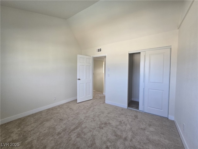 3056 Garnet Ct, Las Vegas, NV 89121 - unfurnished bedroom featuring lofted ceiling, carpet, a closet, and baseboards