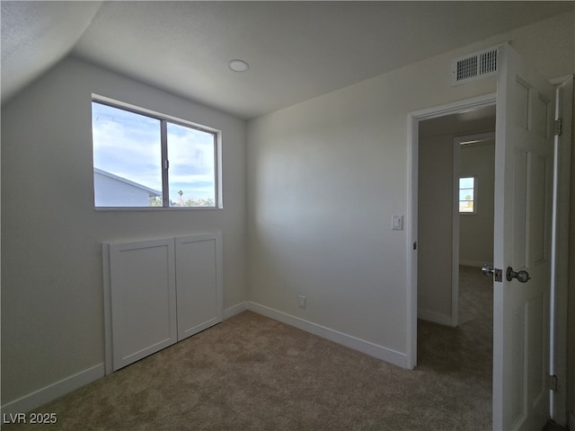 3056 Garnet Ct, Las Vegas, NV 89121 - unfurnished room featuring lofted ceiling, carpet, and baseboards