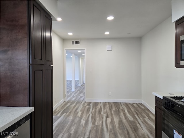 3056 Garnet Ct, Las Vegas, NV 89121 - unfurnished dining area with light wood-style floors, baseboards, and recessed lighting