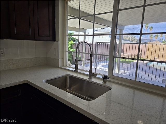 3056 Garnet Ct, Las Vegas, NV 89121 - kitchen featuring a sink and light stone countertops