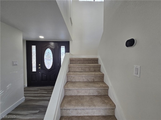 3056 Garnet Ct, Las Vegas, NV 89121 - staircase featuring baseboards, wood finished floors, and recessed lighting