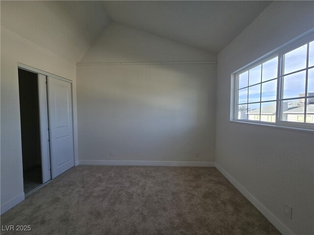 3056 Garnet Ct, Las Vegas, NV 89121 - unfurnished bedroom with vaulted ceiling, carpet flooring, a closet, and baseboards