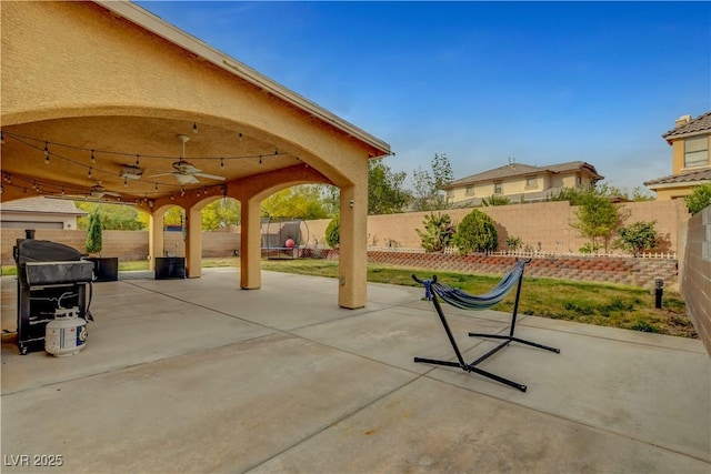 5642 Breckenridge St, North Las Vegas, NV 89081 - fenced backyard featuring a ceiling fan, a patio area, and grilling area