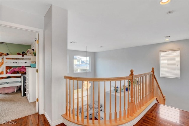 5642 Breckenridge St, North Las Vegas, NV 89081 - hall with wood finished floors, an upstairs landing, recessed lighting, and baseboards