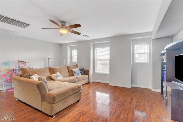 5642 Breckenridge St, North Las Vegas, NV 89081 - living area featuring healthy amount of natural light, ceiling fan, and baseboards