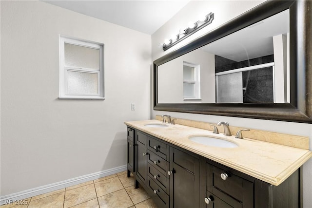 7545 Constantinople Ave, Las Vegas, NV 89129 - full bathroom featuring baseboards, double vanity, a shower stall, and tile patterned floors