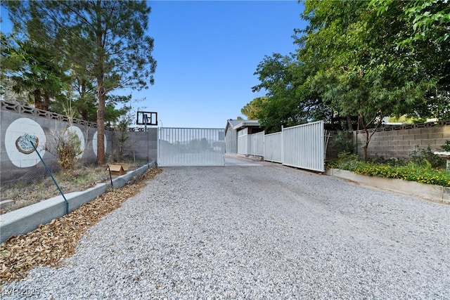 7545 Constantinople Ave, Las Vegas, NV 89129 - view of dirt / gravel road featuring a gated entry and a gate