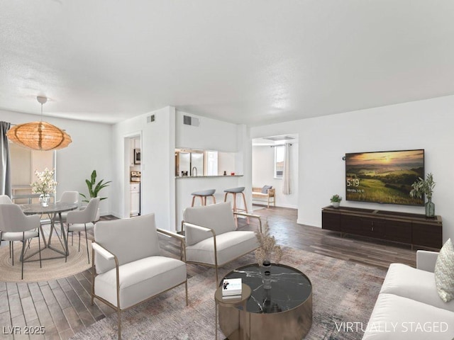 753 Oakmont Ave Unit 802, Las Vegas, NV 89109 - living room with wood finished floors and baseboards
