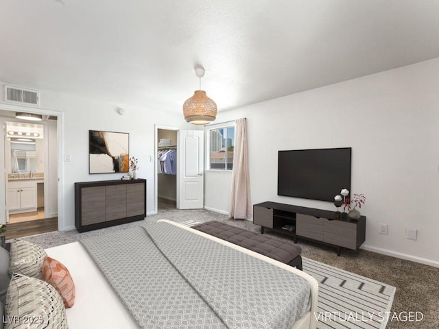753 Oakmont Ave Unit 802, Las Vegas, NV 89109 - bedroom with carpet flooring, a spacious closet, a closet, and baseboards