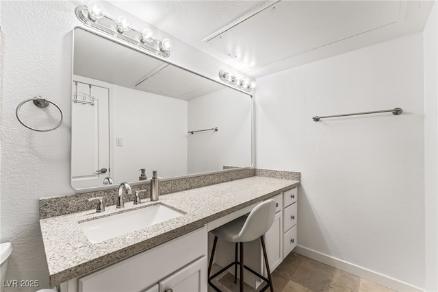 753 Oakmont Ave Unit 802, Las Vegas, NV 89109 - bathroom featuring toilet, vanity, and baseboards